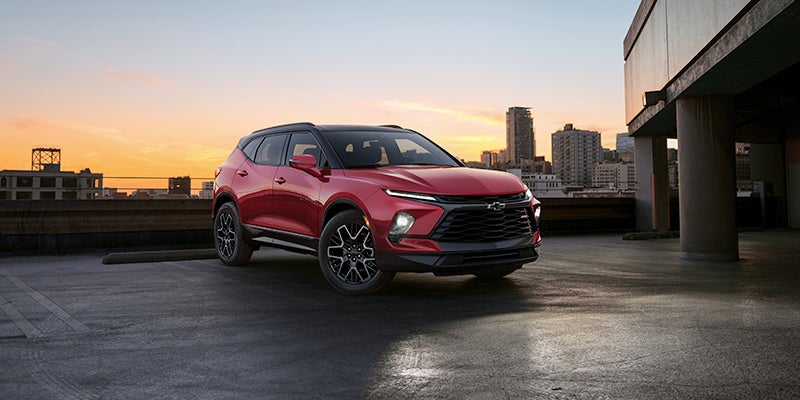 A 2024 Chevrolet Blazer parked in a parking lot, showcasing its sleek design and modern features.